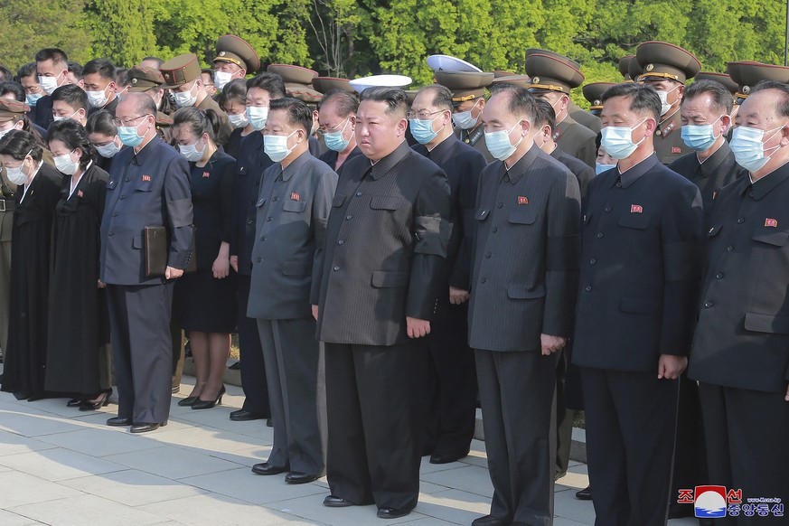 In this photo provided by the North Korean government, North Korean leader Kim Jong Un, center, attends a ceremony for Marshal of the Korean People&#039;s Army Hyon Chol Hae at a cemetery in Pyongyang ...