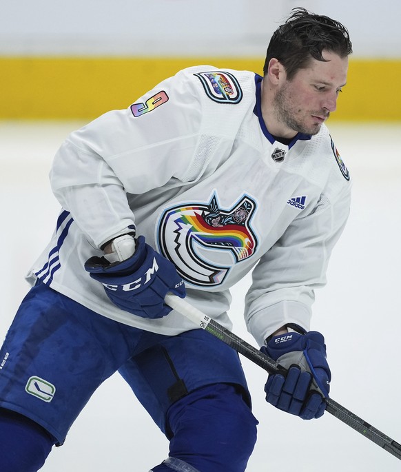 Vancouver Canucks&#039; J.T. Miller wears a pride-themed warmup jersey before the team&#039;s NHL hockey game against the Calgary Flames on Friday, March 31, 2023, in Vancouver, British Columbia. (Dar ...