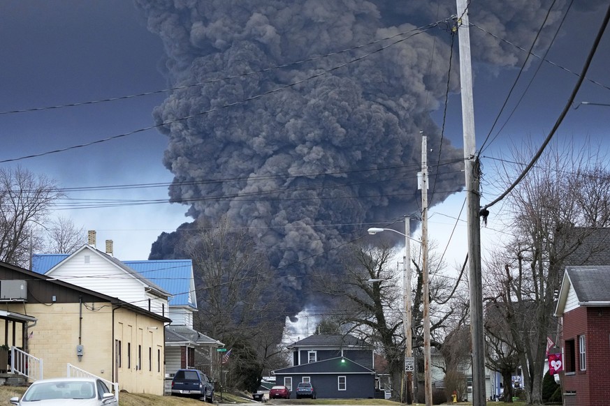 A large plume of smoke rises over East Palestine, Ohio, after a controlled detonation of a portion of the derailed Norfolk Southern trains Monday, Feb. 6, 2023. About 50 cars, including 10 carrying ha ...