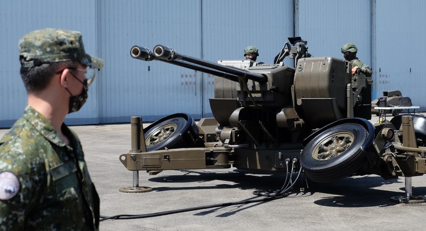 Taiwanese soldiers operate a Oerlikon 35mm twin cannon anti-aircraft gun at a base in Taiwan&#039;s southeastern Hualien county on Thursday, Aug. 18, 2022. Taiwan is staging military exercises to show ...