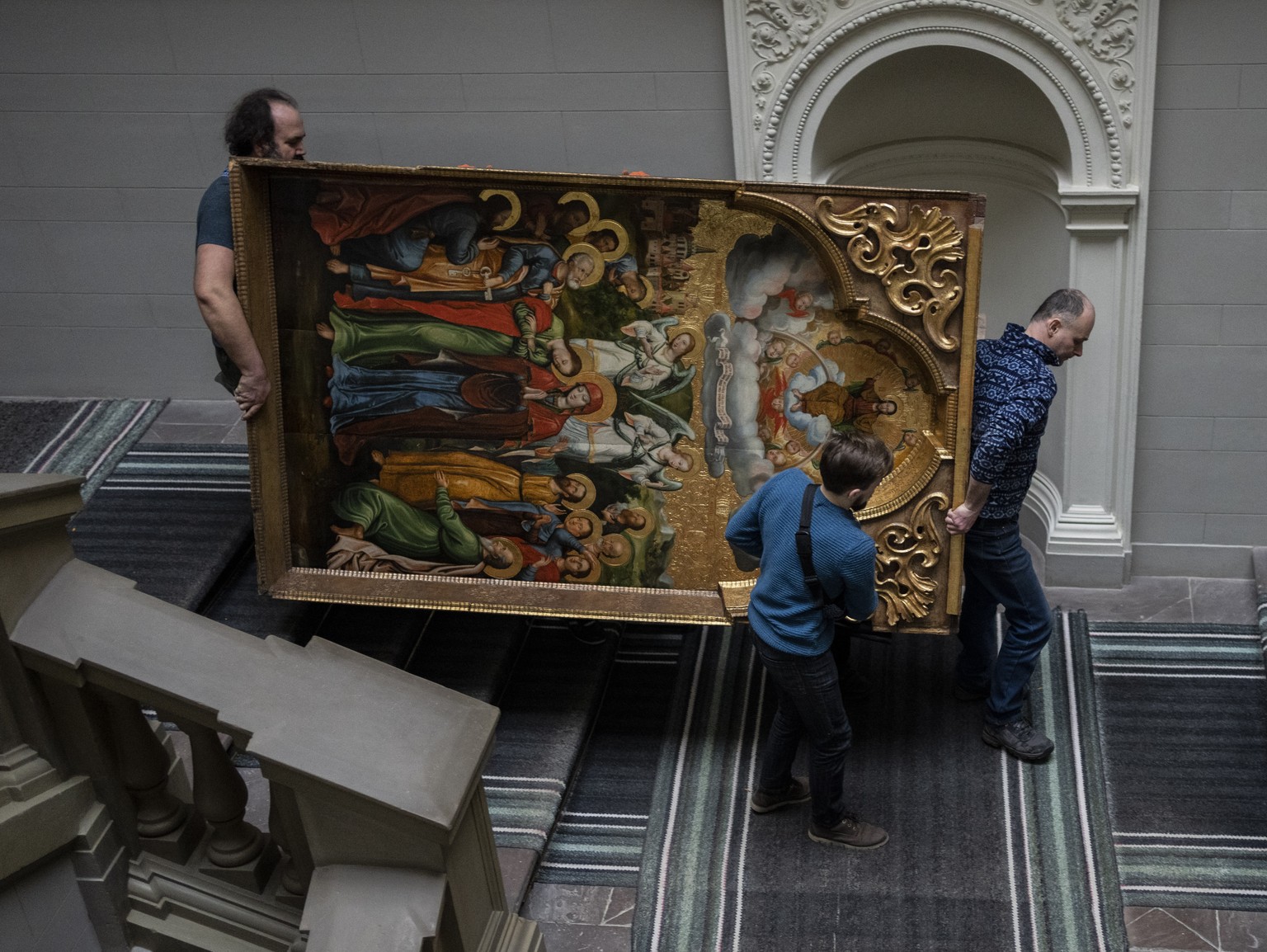 Workers move the Annunciation to the Blessed Virgin of the Bohorodchany Iconostasis in the Andrey Sheptytsky National Museum as part of safety preparations in the event of an attack in the western Ukr ...