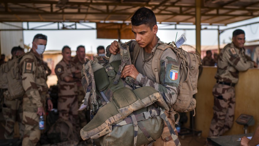 FILE - French Barkhane force soldiers who wrapped up a four-month tour of duty in the Sahel leave their base in Gao, Mali, June 9, 2021. European leaders said troops from the European-led military tas ...