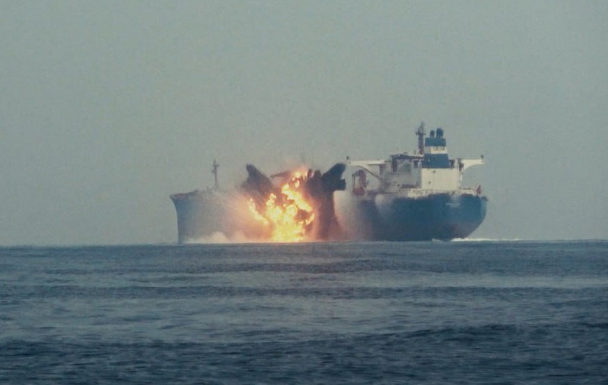 epa11640346 A handout screenshot of footage made available on 03 October 2024 by the Houthis media center shows flames and smoke rising from an explosion at the British oil ship Cordelia Moon after an ...