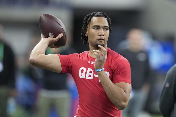 FILE - Ohio State quarterback CJ Stroud runs a drill at the NFL football scouting combine in Indianapolis, March 4, 2023. Stroud threw 85 touchdown passes to break a Big Ten record held by Drew Brees  ...