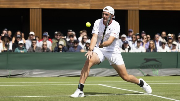 Dominic Stricker of Switzerland in action during his first round match against Alexei Popyrin of Australia at the All England Lawn Tennis Championships in Wimbledon, London, Wednesday, July 5, 2023. ( ...