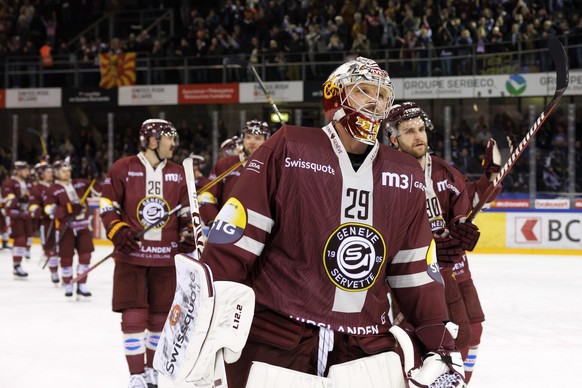 Geneve-Servette&#039;s goaltender Robert Mayer #29 and his teammates greet their supporters after defeating the team Zug, during the third leg of the National League Swiss Championship semifinal playo ...