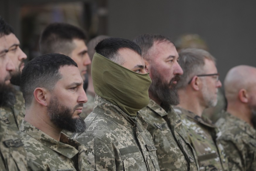 epa10564008 Ukrainian Muslim servicemen listen to a speech of President Zelensky (not pictured) at the Birlik Crimean Tatar cultural center near Kyiv (Kiev), Ukraine, 07 April 2023. Zelensky attended  ...