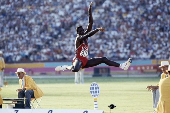 Los Angeles, CA - 1984: Carl Lewis, Men&#039;s long jump competition, Memorial Coliseum, at the 1984 Summer Olympics, August 6, 1984. (Photo by Ken Regan /Disney General Entertainment Content via Gett ...