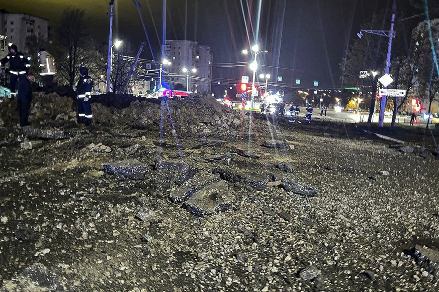 This handout photo released by Telegram Channel of Belgorod Region Governor Vyacheslav Gladkov shows the site of the crater after an explosion in Belgorod, Russia, Friday, April 21, 2023. A large expl ...