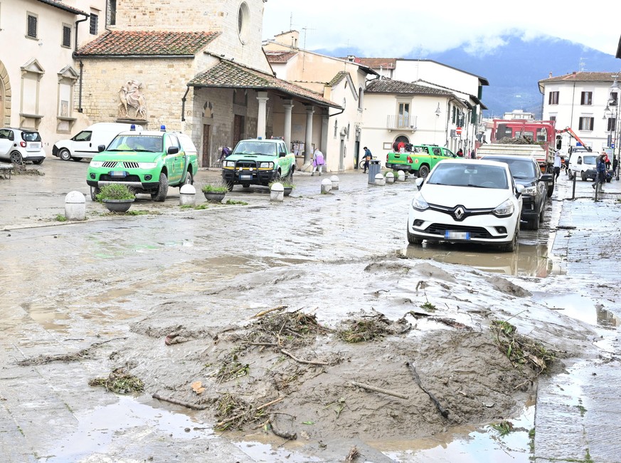 epa11965886 A street covered in mud the day after the flooding of the Rimaggio torrent, in Sesto Fiorentino, Tuscany region, Italy, 15 March 2025. A red weather alert issued on 14 march by authorities ...