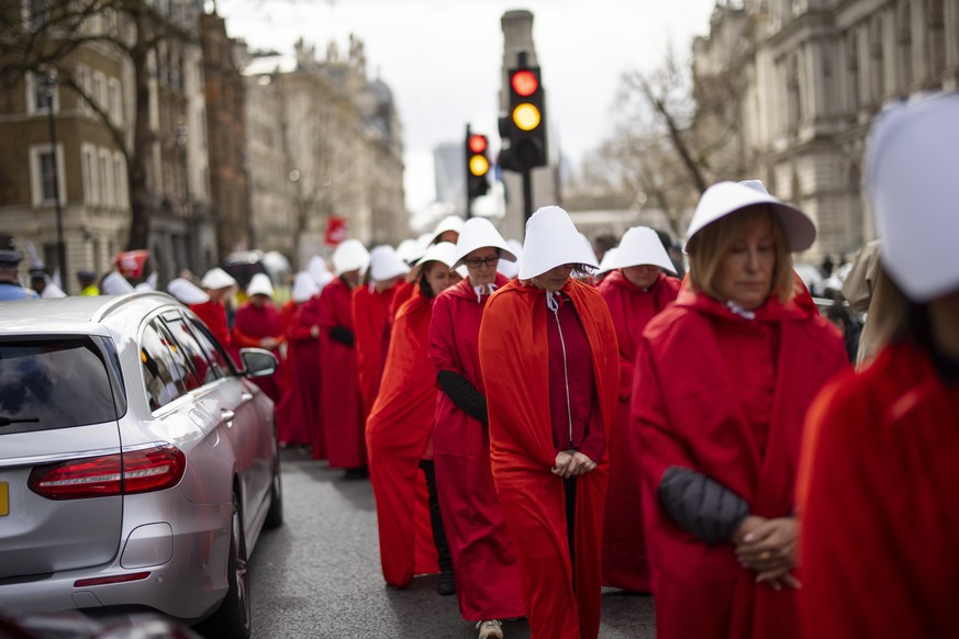 epaselect epa10540639 Women&#039;s rights campaigners dressed as characters from the TV show The Handmaid&#039;s Tale protest against the Israeli government&#039;s planned reform of the justice system ...