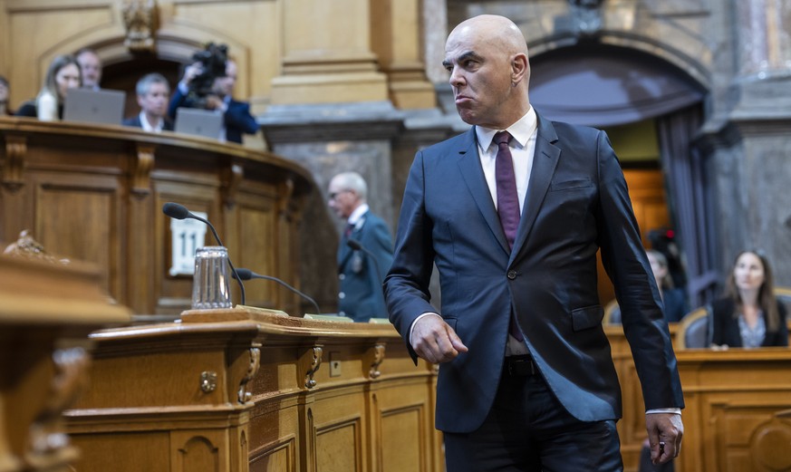 Swiss Federal President Alain Berset steps to his desk to deliver the Federal Council&#039;s statement at the extraordinary session of the Federal Assembly, Tuesday, April 11, 2023 in the Council of S ...