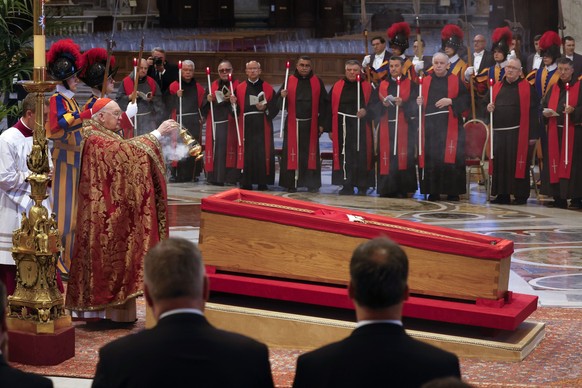VATICAN CITY, VATICAN, APRIL 23:
Cardinal Camerlengo Kevin Joseph Farrell blesses the open casket containing the body of Pope Francis in St. Peter’s Basilica at the Vatican on April 23, 2025. The fait ...