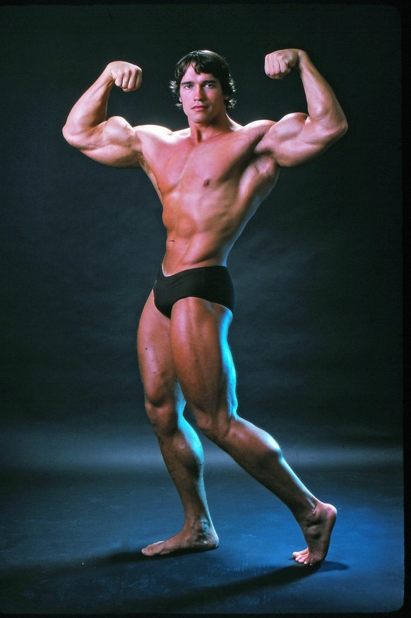 Professional bodybuilder Arnold Schwarzenegger posing at the top of his form in October 1976. (Photo by Jack Mitchell/Getty Images)
