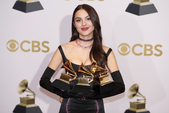 epa09869550 Olivia Rodrigo poses in the press room with her Grammy for Best New Artist and Best Pop Solo Performance for &#039;Drivers License,&#039; during the 64th annual Grammy Awards at the MGM Gr ...