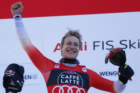The winner Switzerland&#039;s Marco Odermatt celebrates after completing an alpine ski, men&#039;s World Cup downhill race, in Wengen, Switzerland, Saturday, Jan. 13, 2024. (AP Photo/Alessandro Trovat ...