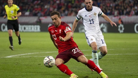 Switzerland&#039;s midfielder Xherdan Shaqiri, left, controls the ball past Northern Ireland&#039;s midfielder Jordan Thompson, right, during the 2022 FIFA World Cup European Qualifying Group C footba ...