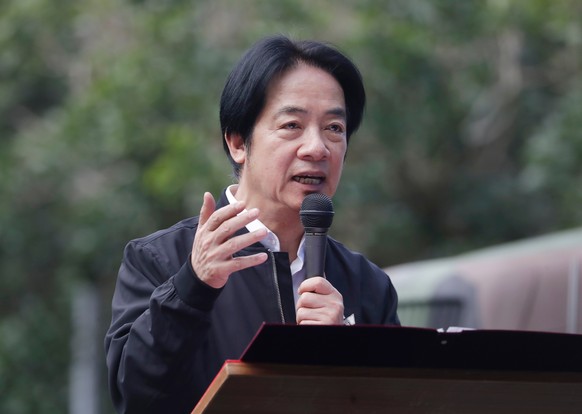 Taiwan President Lai Ching-te delivers a speech as he inspects Taiwanese reservists participating in reserve military training in Ilan County, Eastern Taiwan, Tuesday, Dec. 2, 2025. (AP Photo/Chiang Y ...