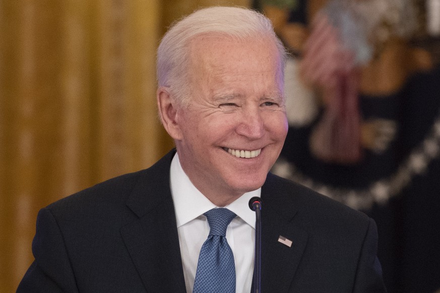 epa09707181 US President Joe Biden participates in a meeting with the White House Competition Council in the East Room of the White House in Washington, DC, USA, 24 January 2022. The meeting was held  ...