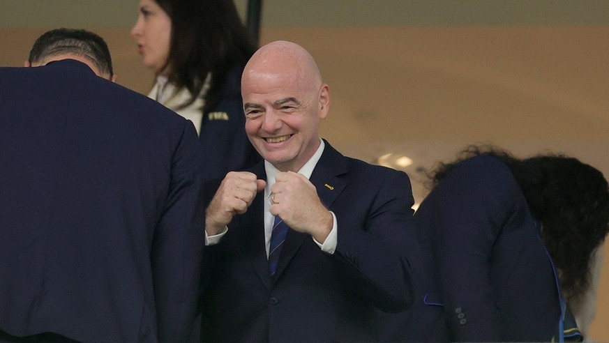 epa10347938 FIFA President Gianni Infantino (C) arrives for the FIFA World Cup 2022 round of 16 soccer match between France and Poland at Al Thumama Stadium in Doha, Qatar, 04 December 2022. EPA/Fried ...