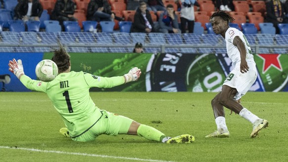 Vilniu&#039;s Francis Kyeremeh, right, scores to 2-2 against Basel&#039;s Goalkeeper Marwin Hitz during the UEFA Europa Conference League group H soccer match between Switzerland&#039;s FC Basel 1893  ...