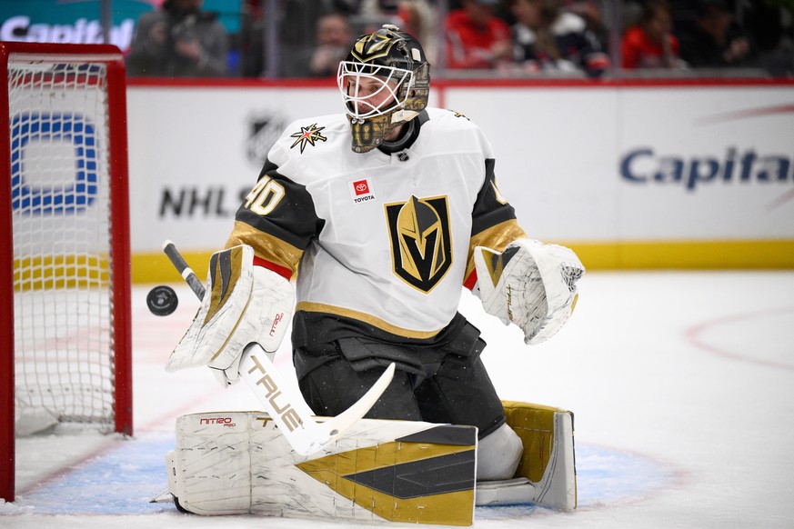 Vegas Golden Knights goaltender Akira Schmid looks for the puck during the first period of an NHL hockey game against the Washington Capitals, Friday, Feb. 27, 2026, in Washington. (AP Photo/Nick Wass ...