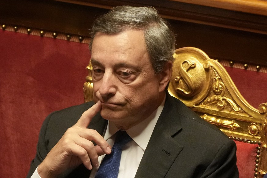 Italian Premier Mario Draghi attends a debate at the Senate in Rome, Wednesday, July 20, 2022. Draghi was deciding Wednesday whether to confirm his resignation or reconsider appeals to rebuild his par ...