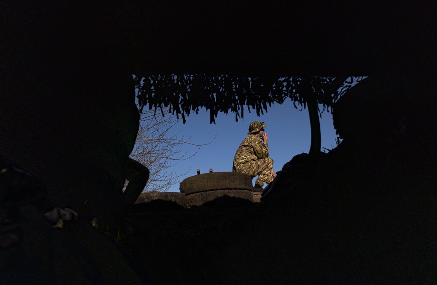 epa09913334 A member of the Ukrainian army guards a checkpoint near the frontline at Huliaipole district, in the Zaporizhzhia region, Ukraine, 27 April 2022. Russian troops entered Ukraine on 24 Febru ...