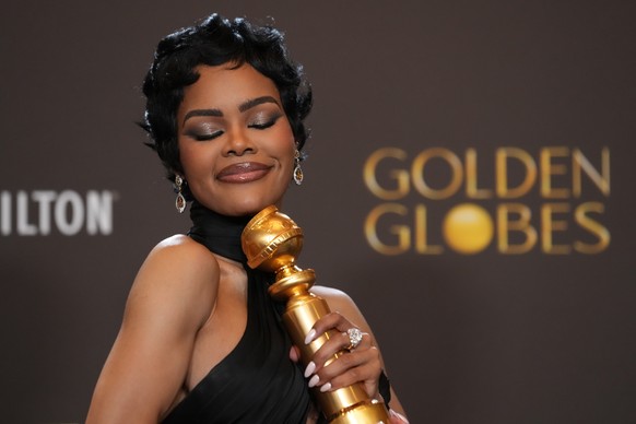 Teyana Taylor poses in the press room with the award for best performance by a female actor in a supporting role in any motion picture for "One Battle After Another" during the 83rd Golden G ...
