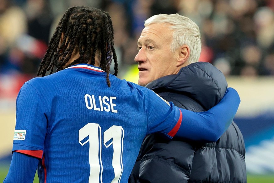 PARIS, FRANCE - MARCH 23: Michael Olise of France and coach of France Didier Deschamps following the penalty shootout of the UEFA Nations League Quarterfinal Leg Two match between France and Croatia a ...