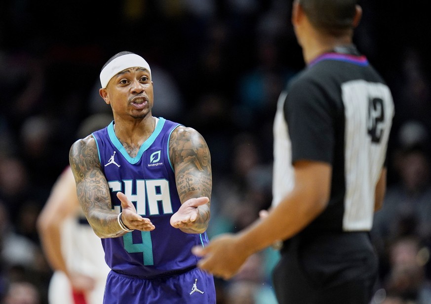 Charlotte Hornets guard Isaiah Thomas (4) questions a technical foul with referee Eric Lewis, right, during the second half of an NBA basketball game against the Washington Wizards on Sunday, April 10 ...