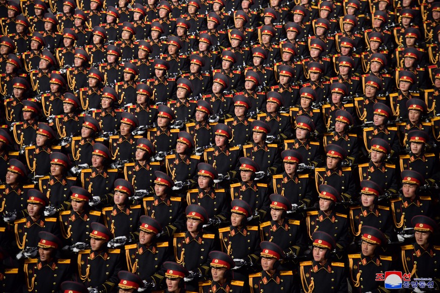 epa10455974 A photo released by the official North Korean Central News Agency (KCNA) shows North Korean soldiers march during a military parade at Kim Il Sung Square to mark the 75th anniversary of th ...