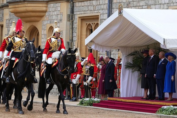WINDSOR, ENGLAND - SEPTEMBER 17: President Donald Trump, King Charles III, Queen Camilla and Melania Trump review the Guard of Honour at Windsor Castle on day two of the US President Donald Trump&#039 ...