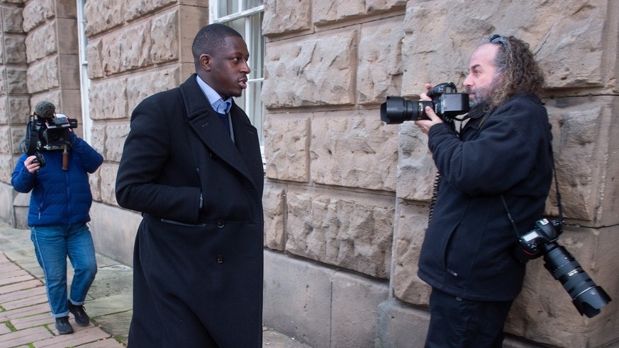 epa10351386 Manchester City and French soccer player Benjamin Mendy arrives at Chester Crown Court in Chester, Britain, 06 December 2022. Mendy is facing trial for eight counts of rape, one count of s ...