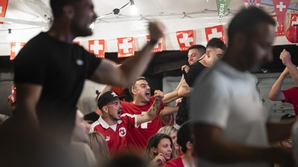 Fans of Switzerland follow the Euro 2020 soccer tournament match between France and Switzerland at a public viewing in S. Antonino, Switzerland, Monday, June 28, 2021. (KEYSTONE/Ti-Press/Pablo Ginanin ...