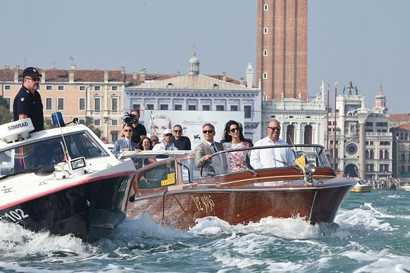 VENICE, ITALY - SEPTEMBER 28: George Clooney and Amal Alamuddin leave the Aman Hotel on September 28, 2014 in Venice, Italy. George Clooney is set to marry his lawyer fiancee Amal Alamuddin this weeke ...