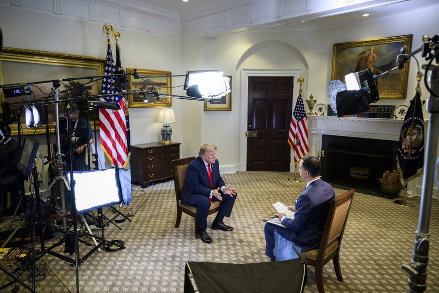 July 14, 2026, Washington, Dc, United States: U.S President Donald Trump responds to a question from Fox News foreign correspondent Trey Yingst during an interview at the Roosevelt Room of the White H ...