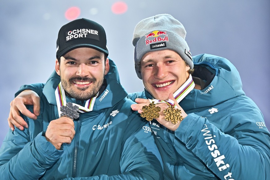 Second placed Loic Meillard of Switzerland, left, and winner Marco Odermatt of Switzerland, pose during the medal ceremony of the men&#039;s giant slalom race at the 2023 FIS Alpine Skiing World Champ ...