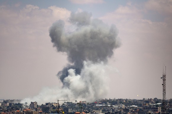 epa11324630 Smoke rises after an Israeli air strike, in Rafah, southern Gaza Strip, 07 May 2024. The Israeli military stated on 07 May, that it conducted &#039;targeted strikes&#039; against Hamas tar ...