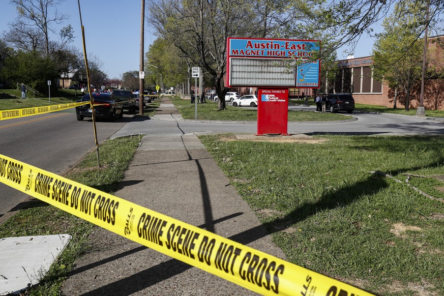 Knoxville police work the scene of a shooting at Austin-East Magnet High School Monday, April 12, 2021, in Knoxville, Tenn. (AP Photo/Wade Payne)