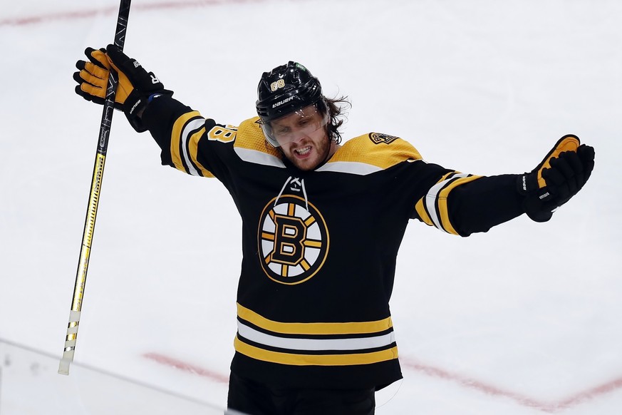 Boston Bruins' David Pastrnak celebrates his goal during the second period of Game 3 of an NHL hockey Stanley Cup first-round playoff series against the Carolina Hurricanes, Friday, May 6, 2022,  ...