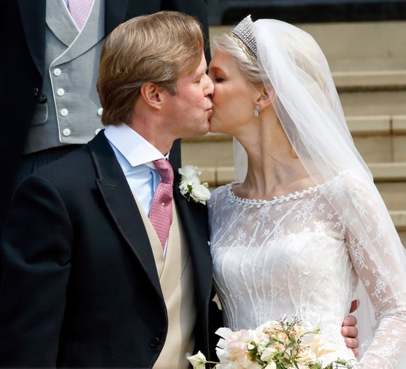 WINDSOR, UNITED KINGDOM - MAY 18: (EMBARGOED FOR PUBLICATION IN UK NEWSPAPERS UNTIL 24 HOURS AFTER CREATE DATE AND TIME) Thomas Kingston and Lady Gabriella Windsor kiss as they leave St George&#039;s  ...