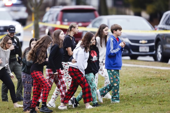 epa11781601 Students on the grounds of Abundant Life Christian School following a shooting earlier in the day in Madison, Wisconsin, USA, 16 December 2024. According a social media post by the Madison ...