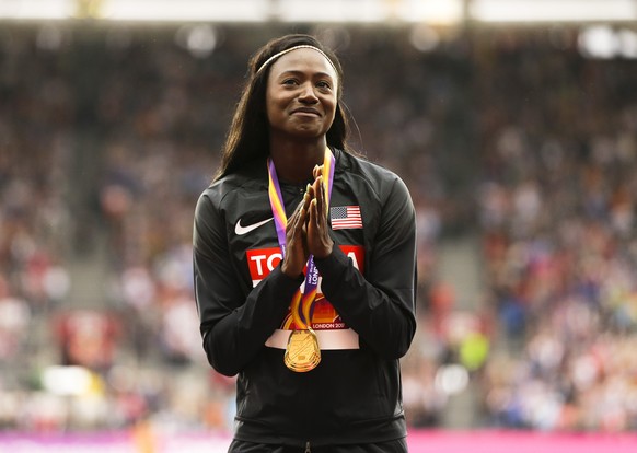 FILE - United States&#039; Tori Bowie gestures after receiving the gold medal she won in the women&#039;s 100m final during the World Athletics Championships in London, Monday, Aug. 7, 2017. Tori Bowi ...