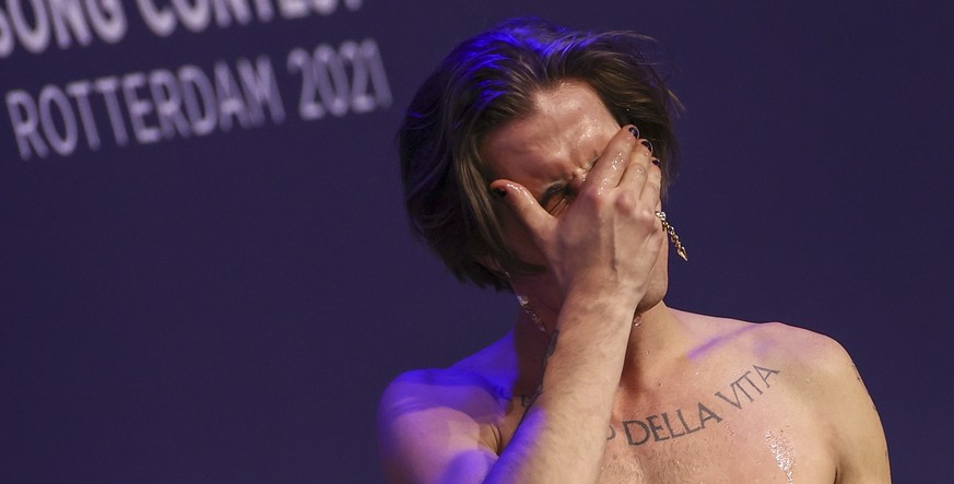 epa09221783 A member from the band Maneskin from Italy reacts during a press conference after winning the Grand Final of the 65th annual Eurovision Song Contest (ESC) at the Rotterdam Ahoy arena, in R ...