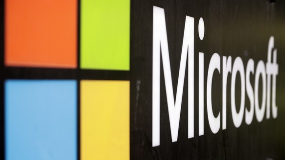FILE - The Microsoft company logo is displayed at their offices in Sydney, Australia, on Wednesday, Feb. 3, 2021. The Competition and Markets Authority said in a brief statement Monday, Dec. 13, 2021  ...