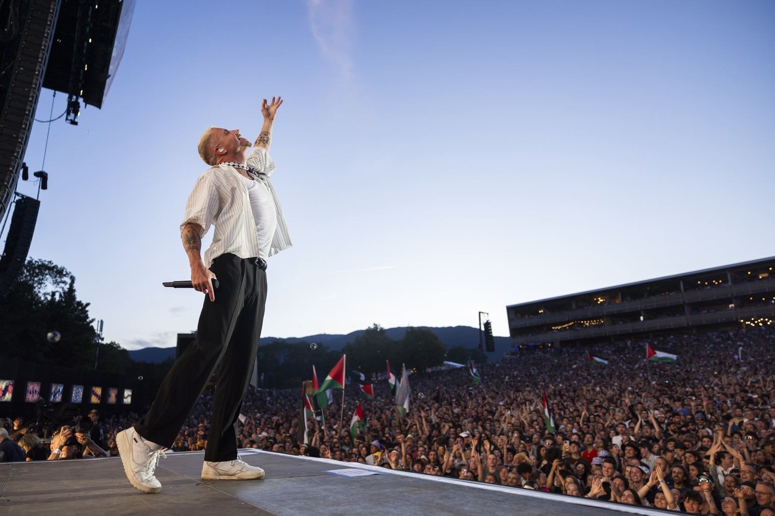 American singer Macklemore performs on the main stage, during the 48th edition of the Paleo Festival, in Nyon, Switzerland, Tuesday, July 22, 2025. The Paleo is an open-air music festival in the weste ...