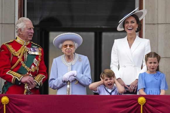 Prince Charles, from left, Queen Elizabeth II, Prince Louis, Kate, Duchess of Cambridge, Princess Charlotte on the balcony of Buckingham Palace, London, Thursday June 2, 2022, on the first of four day ...