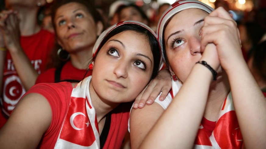 Turkish soccer fans show their disappointment in the fan zone in Basel, Switzerland, Wednesday, June 25, 2008, after the semifinal match between Germany and Turkey at the Euro 2008 European Soccer Cha ...