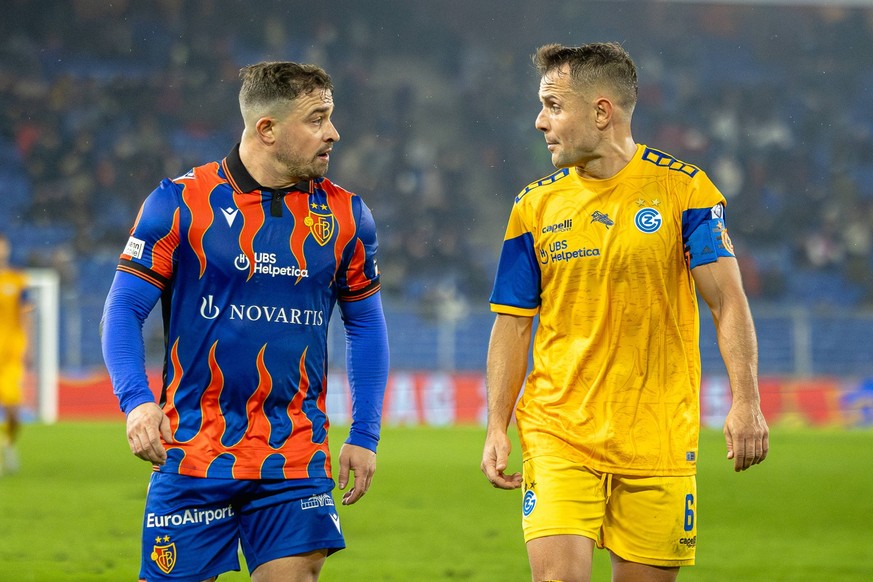 Basel, Switzerland, December 14st 2024: A debate between Xherdan Shaqiri 10 Basel and Amir Abrashi 6 GCZ during the Super League football match between FC Basel 1893 and Grasshopper Club Zurich at St. ...